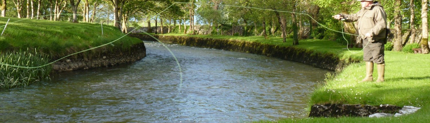 A fisherman Fly Fishing for trout on the River Clare at Milltown Co. Galway