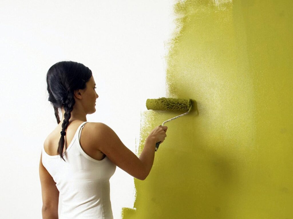 Girl painting wall