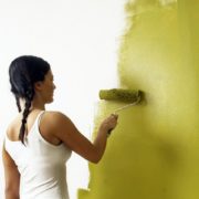 Girl painting wall