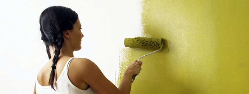 Girl painting wall
